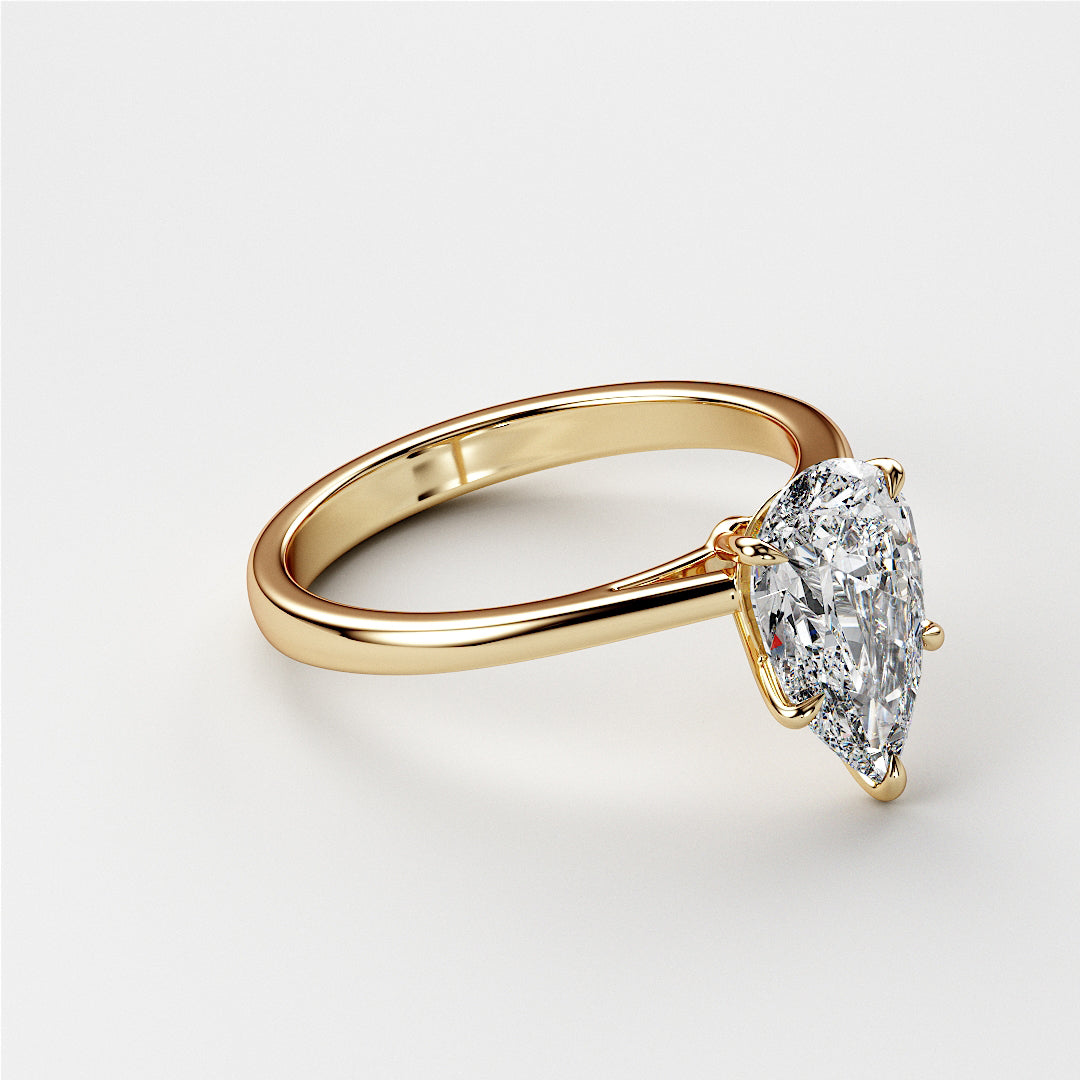 14K Gold Pear-Shaped Diamond Engagement Ring - side view of the elegant solitaire in a sleek cathedral setting.|
#14KRecycledYellowGold
#18KRecycledYellowGold