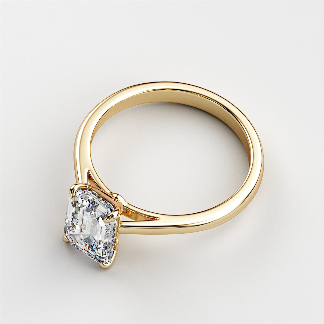 Elegant 14K gold engagement ring featuring a radiant-cut diamond in classic solitaire design. Available in 18K gold and platinum.|
#14KRecycledYellowGold
#18KRecycledYellowGold