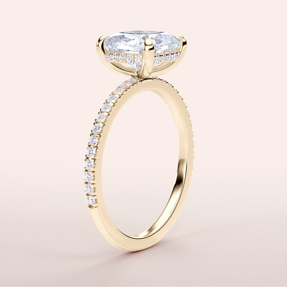 Elegant 14K yellow gold engagement ring with marquise-cut diamond centerpiece and pave band detailing. Perfect for proposals.|
#14KRecycledYellowGold
#18KRecycledYellowGold