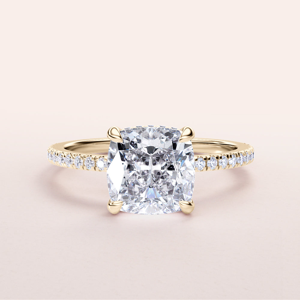 Elegant 14K gold cushion-cut diamond ring with a diamond-studded band on a neutral background. Perfect for engagement.|
#14KRecycledYellowGold
#18KRecycledYellowGold