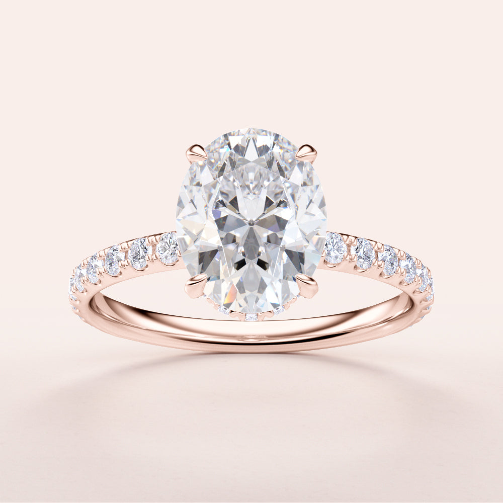 Stunning oval diamond ring in 14K or 18K rose gold, featuring a hidden halo andPave band, perfect for engagements.
#14KRecycledRoseGold
#18KRecycledRoseGold