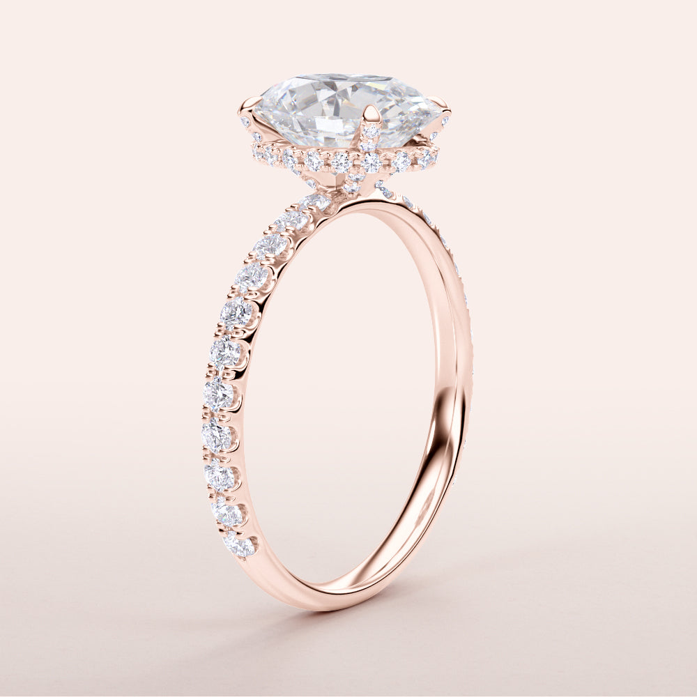 Elegant rose gold engagement ring with marquise diamond center and halo, adorned with additional diamonds. Available in 14K, 18K, or platinum.|
#14KRecycledRoseGold
#18KRecycledRoseGold