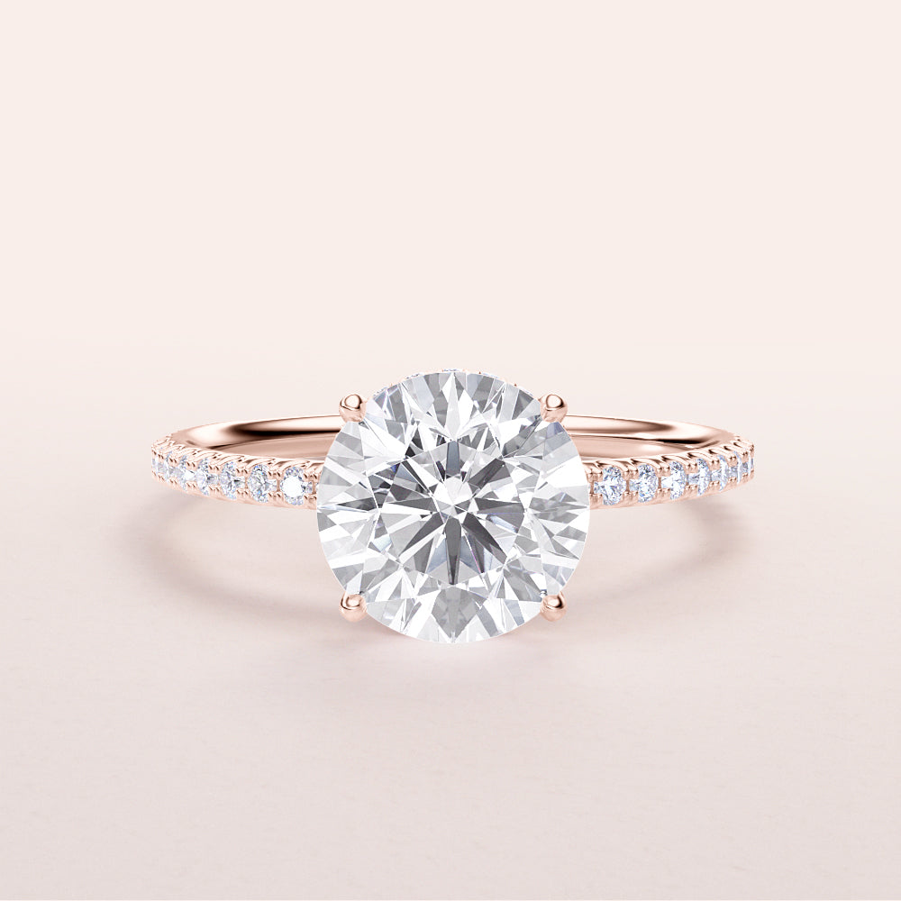 Elegant rose gold engagement ring featuring a round cut diamond andPave band, available in 14K, 18K, or platinum.|
#14KRecycledRoseGold
#18KRecycledRoseGold