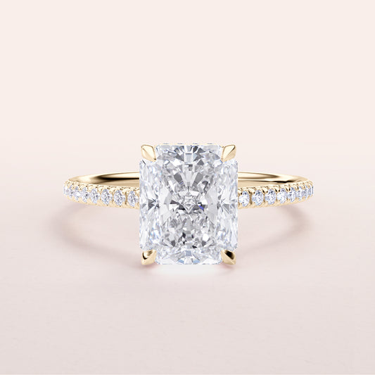 Radiant cut diamond engagement ring in 14K or 18K yellow gold, featuring aPave band and a classic four-prong setting.