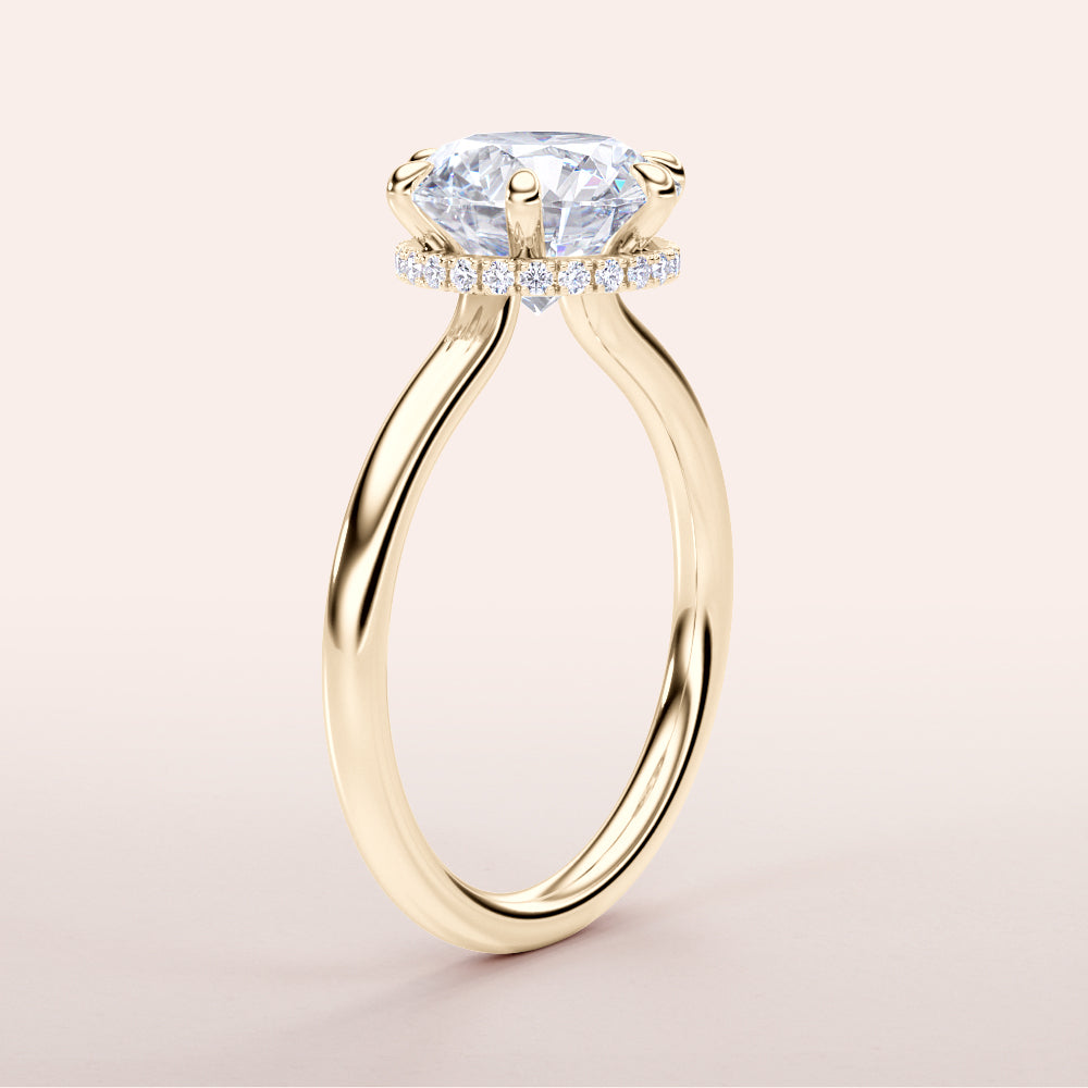 Elegant round diamond engagement ring in 14K yellow gold, featuring a hidden halo design and a sleek plain band.|
#14KRecycledYellowGold
#18KRecycledYellowGold