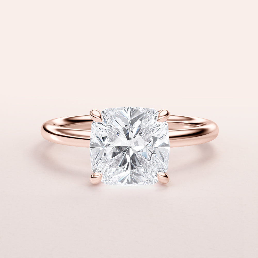 Elegant 14K rose gold engagement ring featuring a cushion cut diamond center stone for timeless beauty and sophistication.|
#14KRecycledRoseGold
#18KRecycledRoseGold