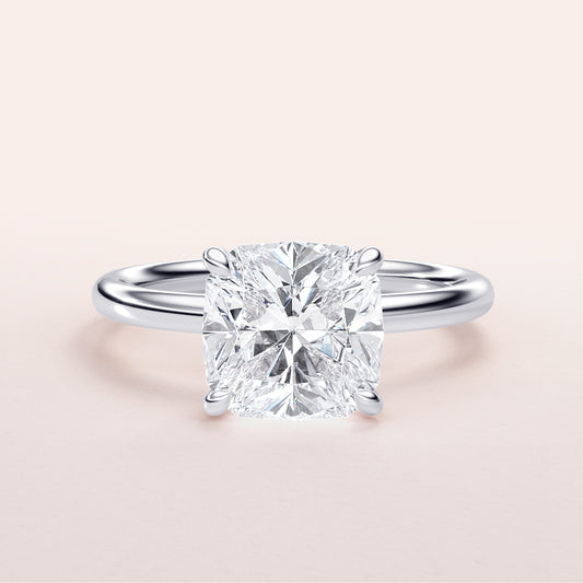 Elegant cushion-cut diamond engagement ring in 14K or 18K white gold or platinum setting. Perfect for timeless romance.
