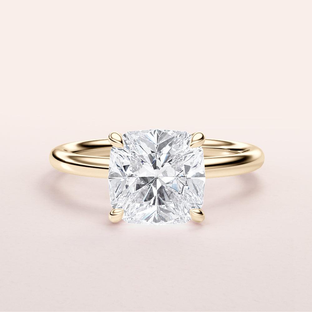 Radiant cut diamond engagement ring in 14K yellow gold, displayed on a light background, highlighting its classic solitaire style.|
#14KRecycledYellowGold
#18KRecycledYellowGold