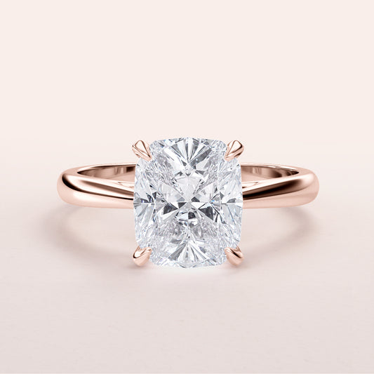 Elegant 14K Rose Gold engagement ring featuring a cushion cut diamond, perfect for your timeless love story.