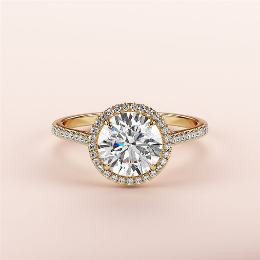 Elegant 14K/18K gold halo engagement ring with round brilliant diamond and sparkling pave band, showcasing timeless beauty.