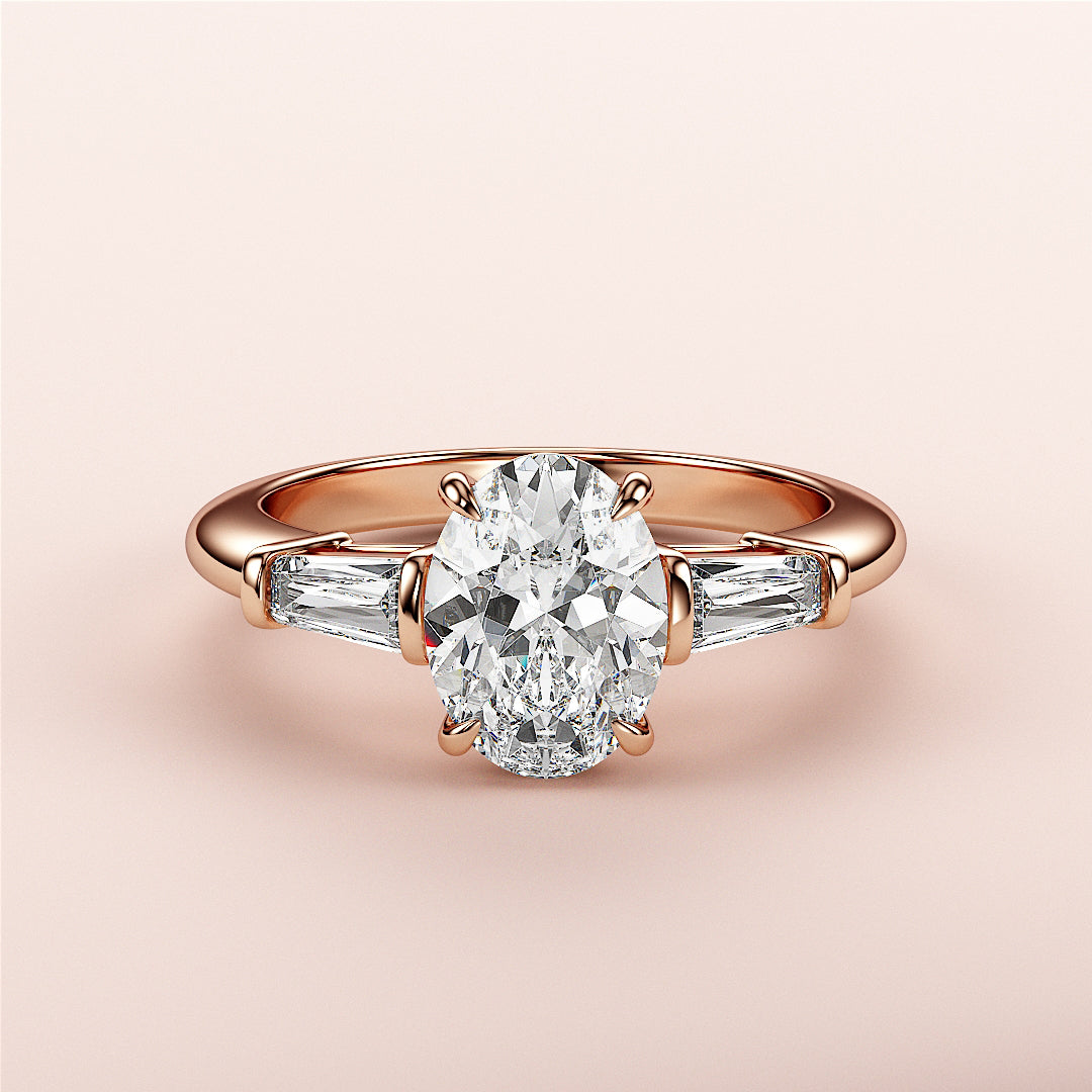 Elegant oval-shaped rose gold engagement ring with side baguette diamonds, available in 14K, 18K, or platinum.|
#14KRecycledRoseGold
#18KRecycledRoseGold