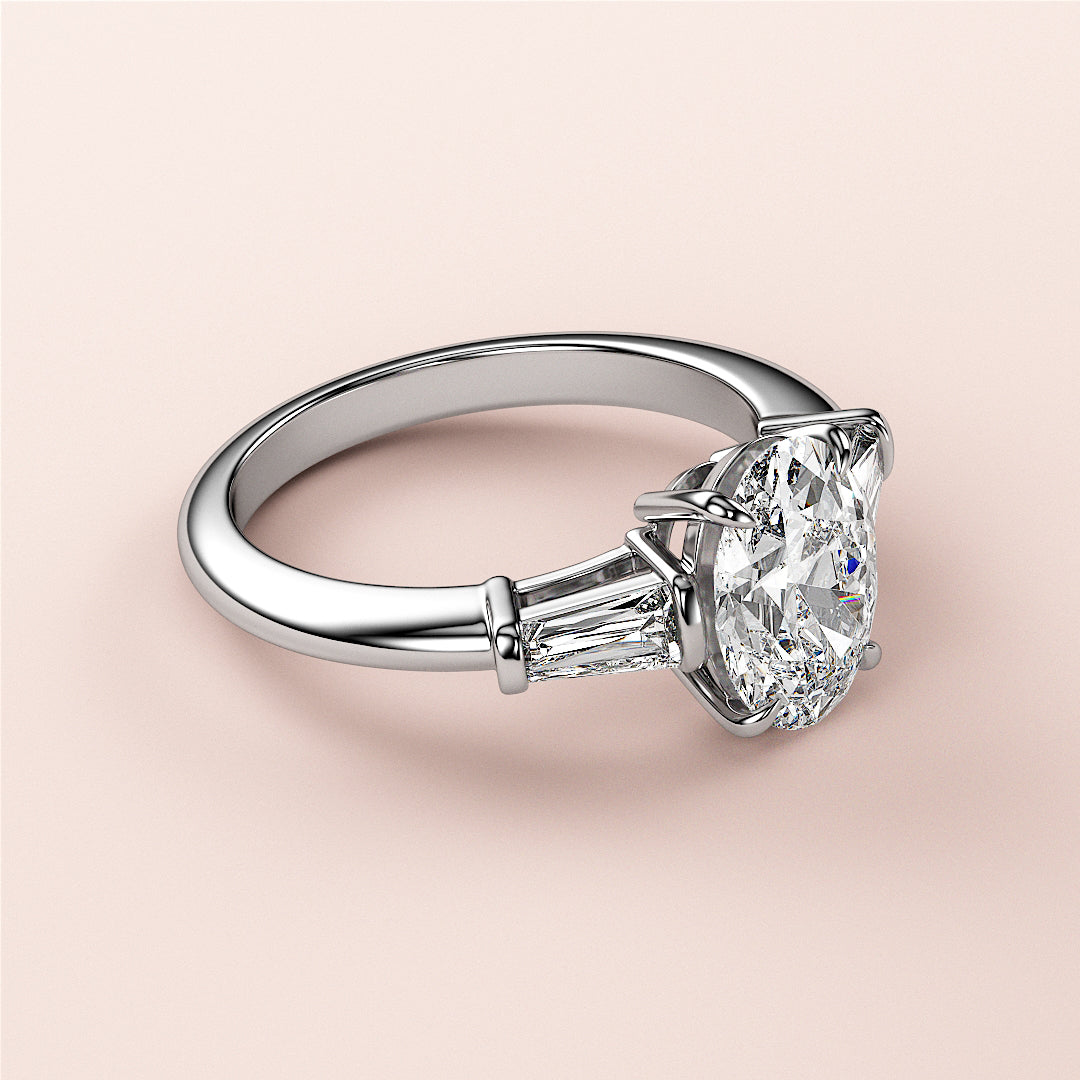 Elegant oval-shaped diamond engagement ring in 14K/18K white gold or platinum with tapered baguette diamonds for added brilliance.|
#14KRecycledWhiteGold
#18KRecycledWhiteGold
#Platinum