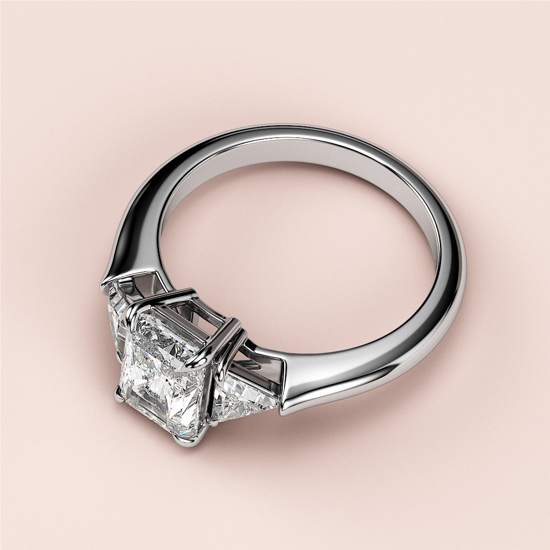 Elegant princess-cut diamond engagement ring in 14K white gold, featuring three sparkling stones for a timeless design.|
#14KRecycledWhiteGold
#18KRecycledWhiteGold
#Platinum