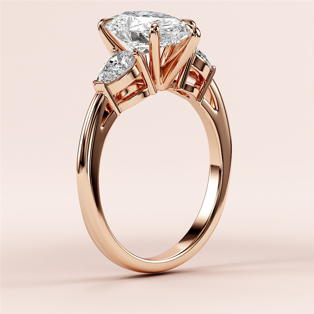 Elegant rose gold pear three stone engagement ring, featuring a stunning design in 14K/18K gold or platinum, exuding timeless luxury.|
#14KRecycledRoseGold
#18KRecycledRoseGold