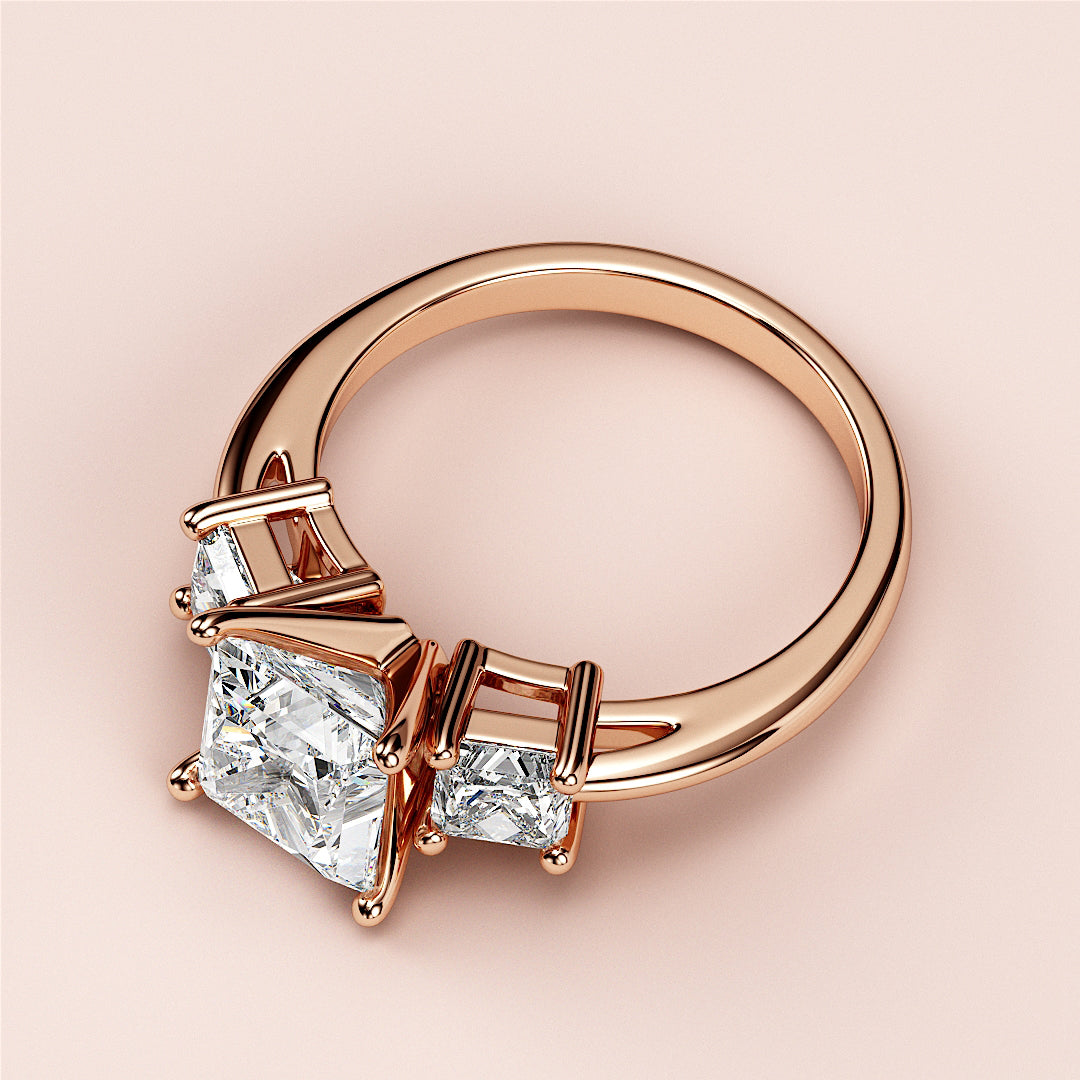 Elegant rose gold three-stone engagement ring with a princess-cut diamond, available in 14K or 18K gold and platinum.|
#14KRecycledRoseGold
#18KRecycledRoseGold