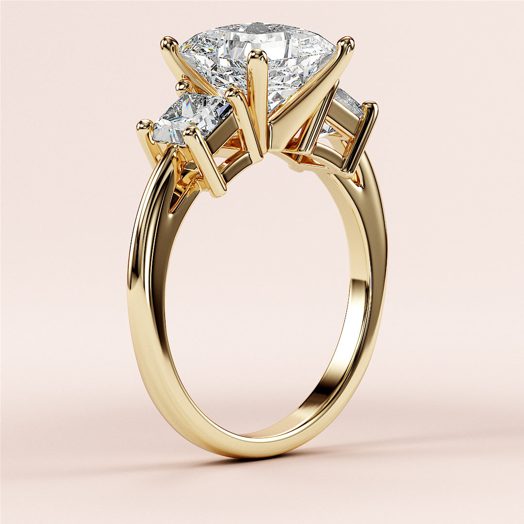 Elegant three-stone princess engagement ring in 14K gold, featuring an oval diamond centerpiece and surrounded by round diamonds.|
#14KRecycledYellowGold
#18KRecycledYellowGold