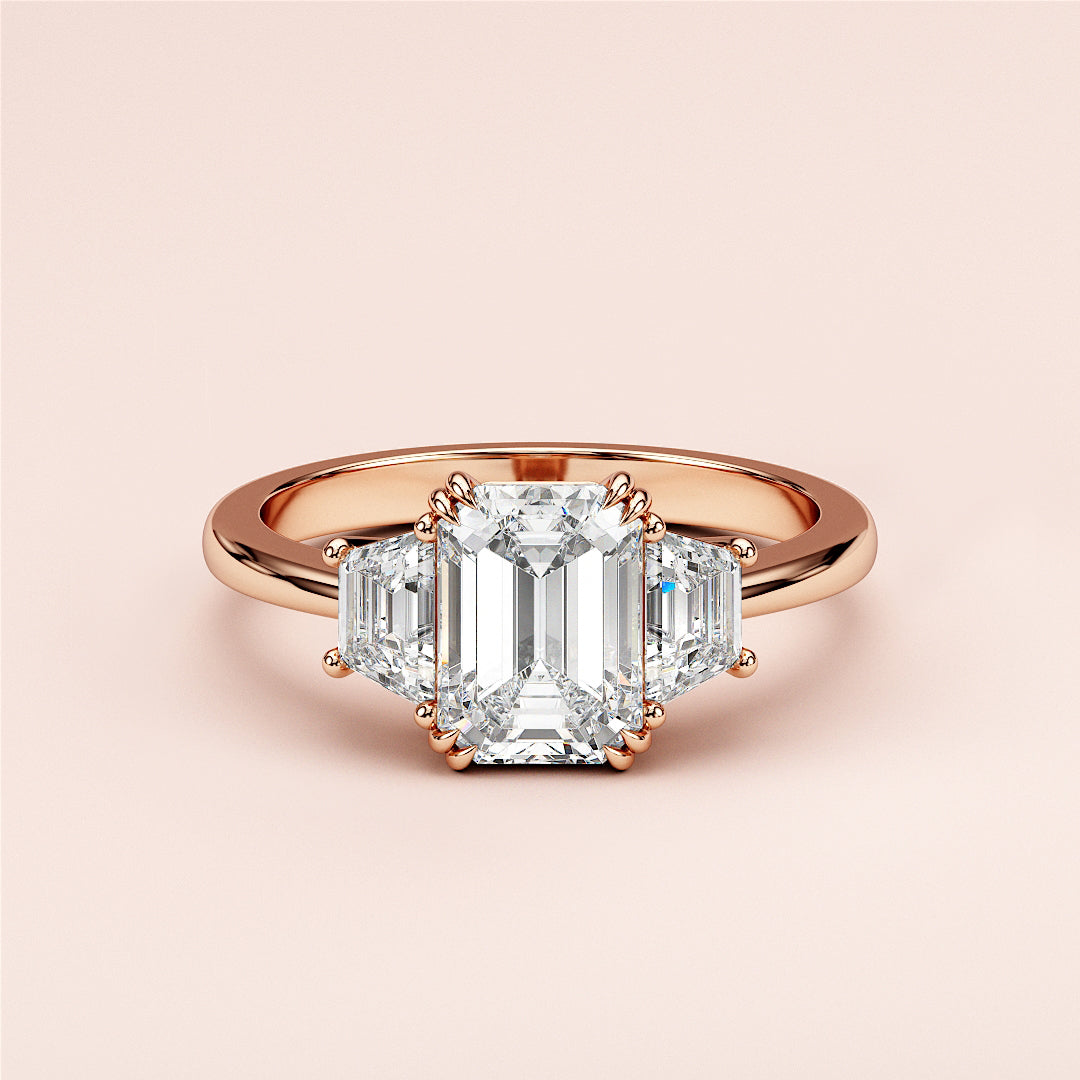 Emerald-cut diamond engagement ring in 14K/18K rose gold or platinum, featuring two stunning trapezoid side stones.|
#14KRecycledRoseGold
#18KRecycledRoseGold