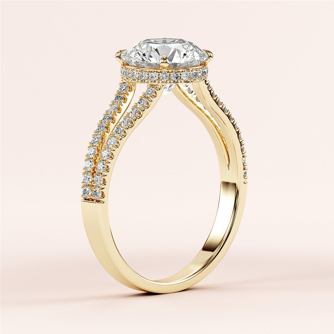 14K yellow gold engagement ring with a large oval diamond center, halo, and pave-set diamonds on the split shank.|
#14KRecycledYellowGold
#18KRecycledYellowGold