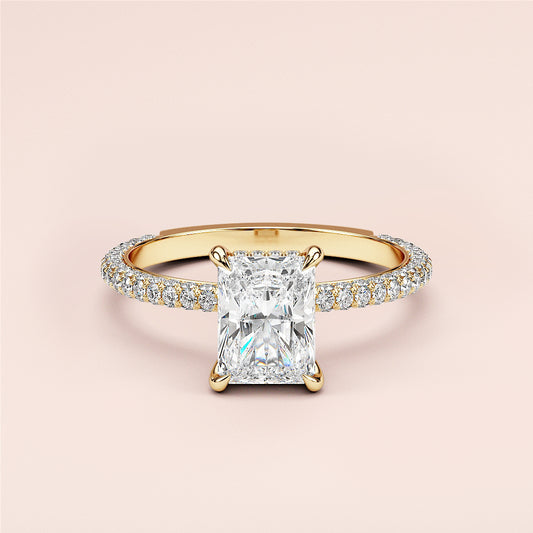 Elegant rectangular diamond engagement ring in 14K gold withPave band, displayed on a pastel background.
