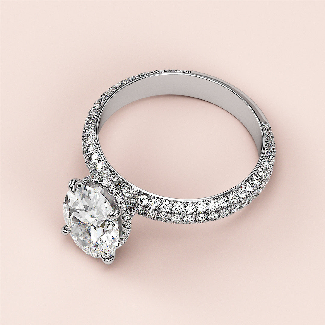 Dazzling oval-cut diamond engagement ring with hidden halo accents in 14K white gold, enhanced by sparklingPave diamonds.|
#14KRecycledWhiteGold
#18KRecycledWhiteGold
#Platinum