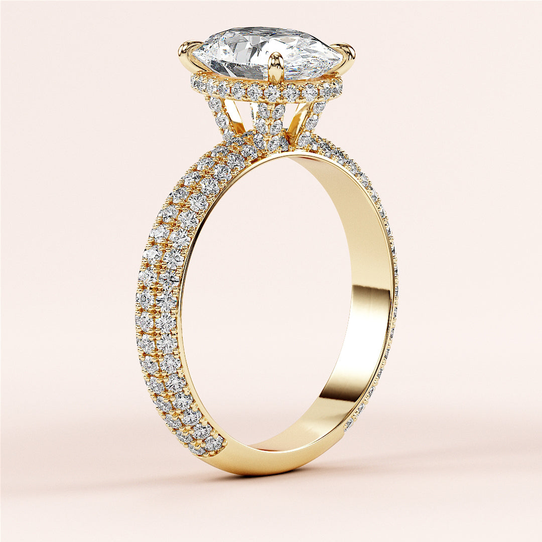 Elegant 14K yellow gold engagement ring with marquise-cut diamond and pave-set accents, perfect for special occasions.|
#14KRecycledYellowGold
#18KRecycledYellowGold