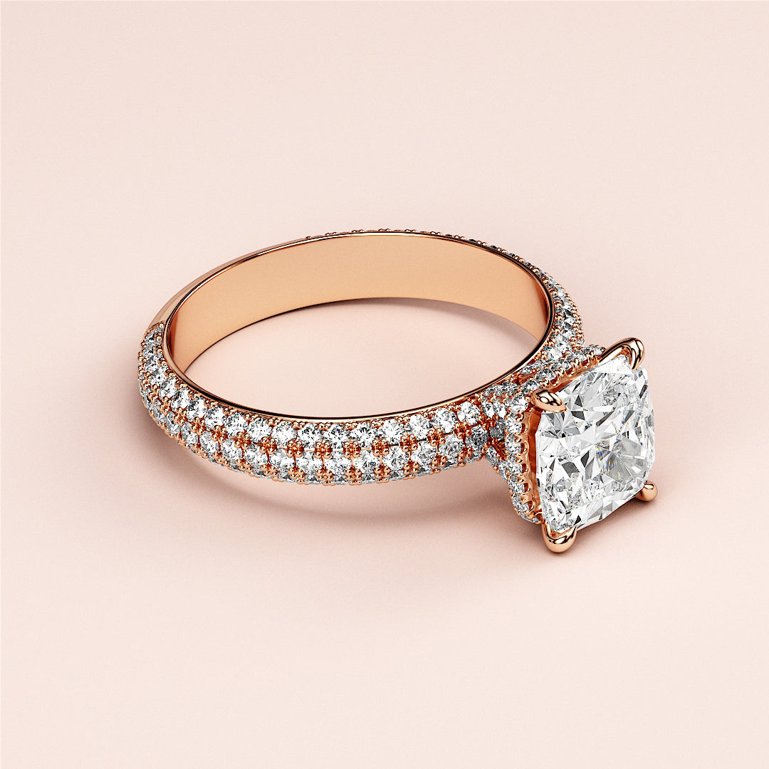 Elegant 14K or 18K rose gold engagement ring with a cushion-cut diamond and sparklingPave band accents.|
#14KRecycledRoseGold
#18KRecycledRoseGold