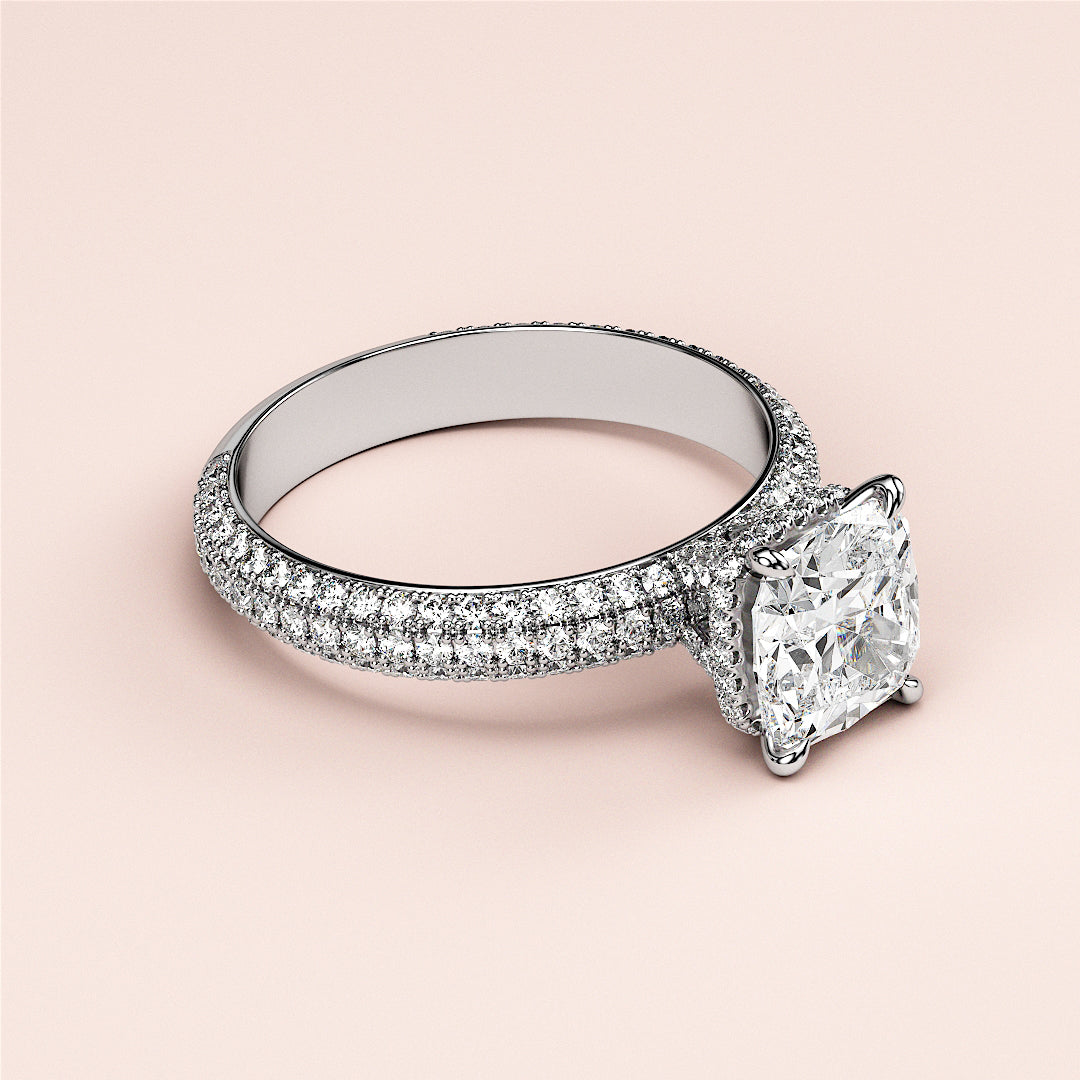 Elegant cushion-cut diamond engagement ring in 14K/18K white gold, featuring a dazzlingPave band and shimmering accent diamonds.|
#14KRecycledWhiteGold
#18KRecycledWhiteGold
#Platinum