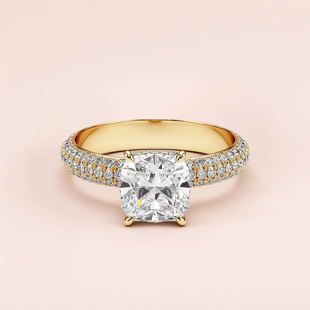 Elegant 14K yellow gold engagement ring with a cushion-cut diamond and pave setting, showcasing exquisite craftsmanship.|
#14KRecycledYellowGold
#18KRecycledYellowGold