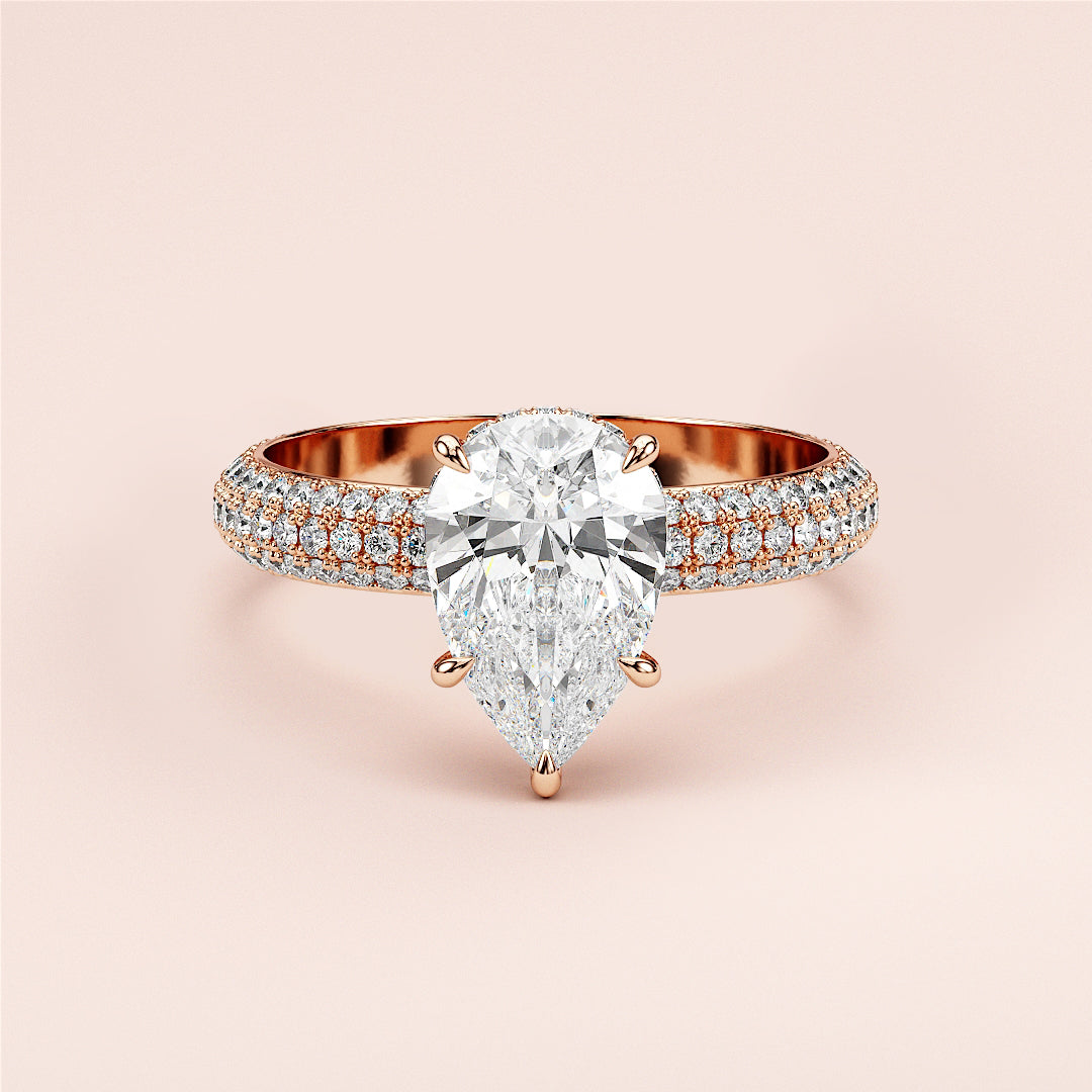 Elegant pear-shaped diamond engagement ring in 14K/18K rose gold with halo accents, perfect for engagements or special occasions.|
#14KRecycledRoseGold
#18KRecycledRoseGold