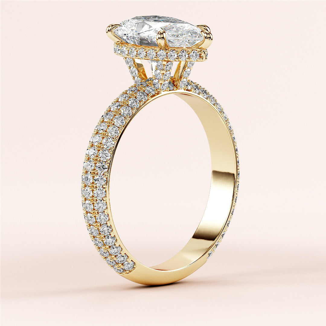 14K yellow gold engagement ring with a pear-shaped diamond andPave accents, showcasing a luxurious and elegant design.|
#14KRecycledYellowGold
#18KRecycledYellowGold