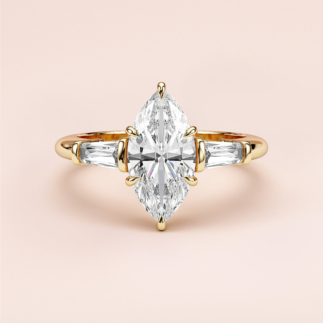 Elegant marquise-cut diamond engagement ring in 14K yellow gold, featuring side accent diamonds for a sophisticated look.|
#14KRecycledYellowGold
#18KRecycledYellowGold