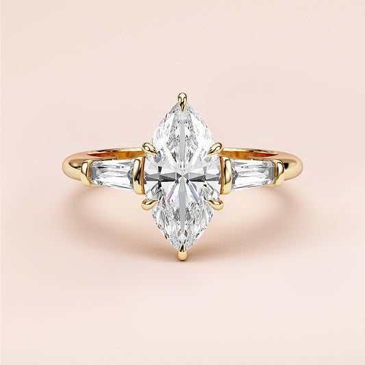 Elegant marquise-cut diamond engagement ring in 14K yellow gold, featuring side accent diamonds for a sophisticated look.