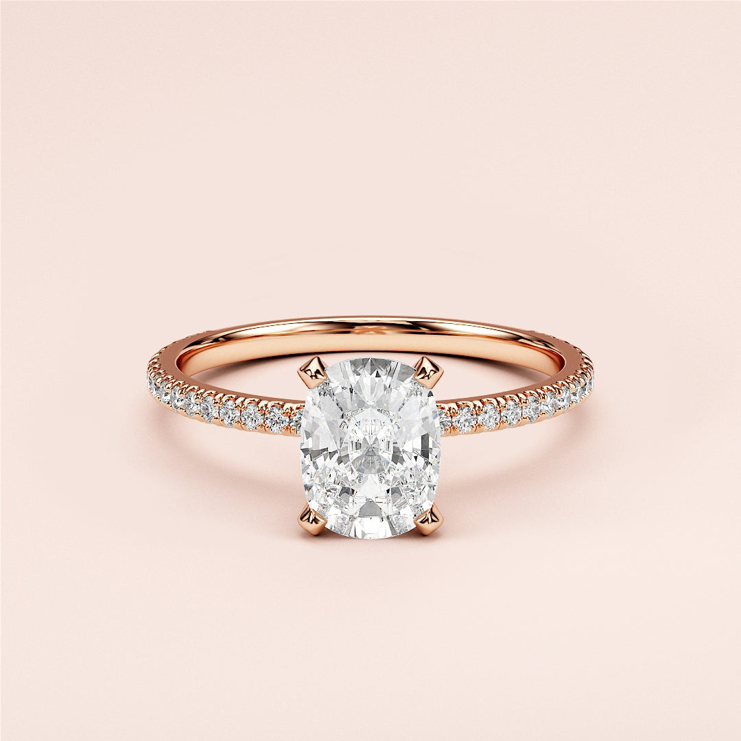 Elegant oval diamond engagement ring in 14K or 18K gold or platinum, featuring a stunning pave-set band and center stone.|
#14KRecycledRoseGold
#18KRecycledRoseGold