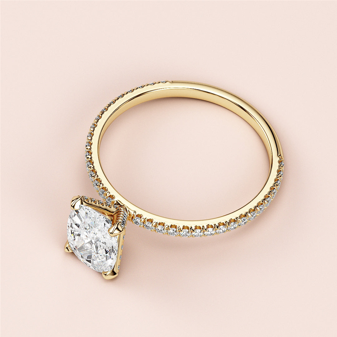 Elegant 14K or 18K gold engagement ring with cushion-cut diamond center and diamond-accented pave band. Perfect for special occasions.|
#14KRecycledYellowGold
#18KRecycledYellowGold