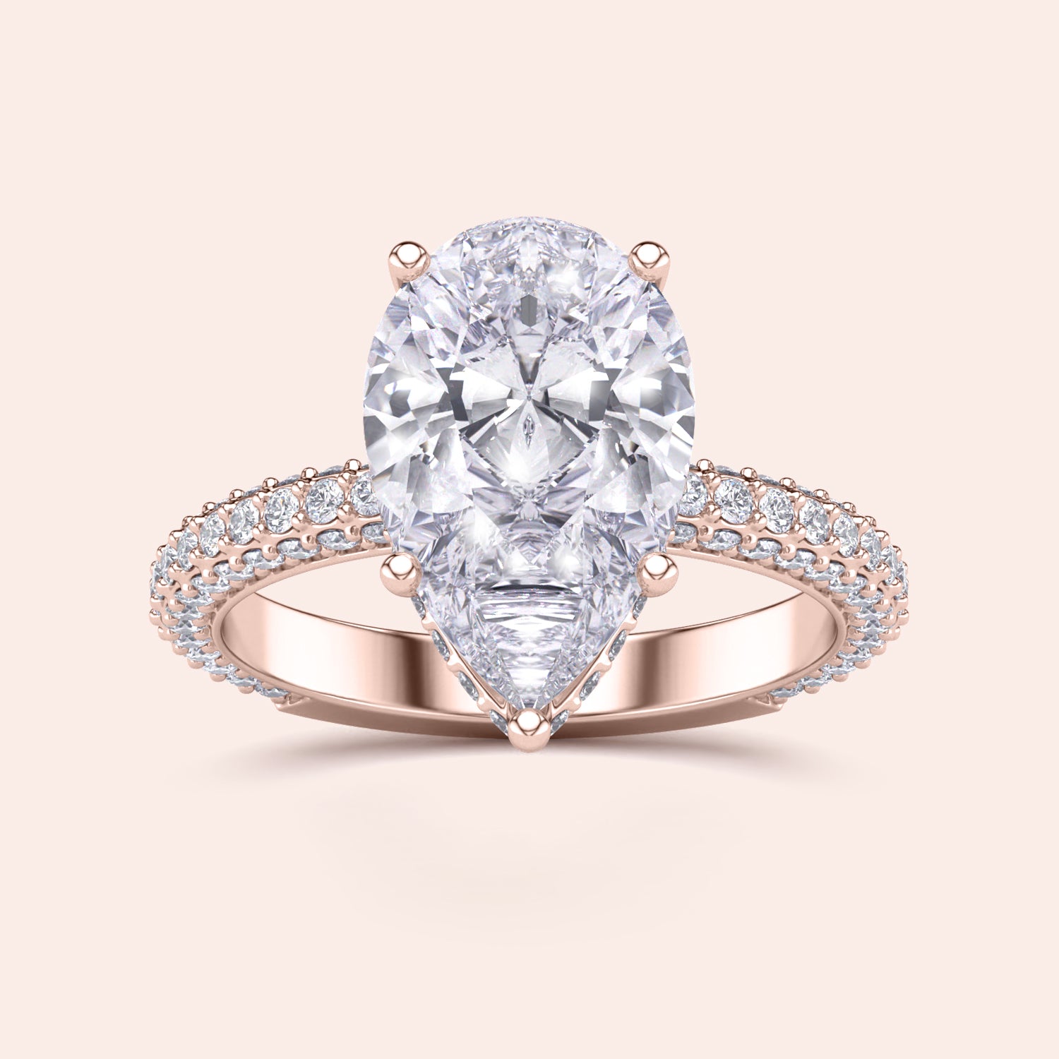 Elegant 14K/18K rose gold pear-shaped diamond engagement ring with hidden halo and prong accents, not worn on model.|
#14KRecycledRoseGold
#18KRecycledRoseGold