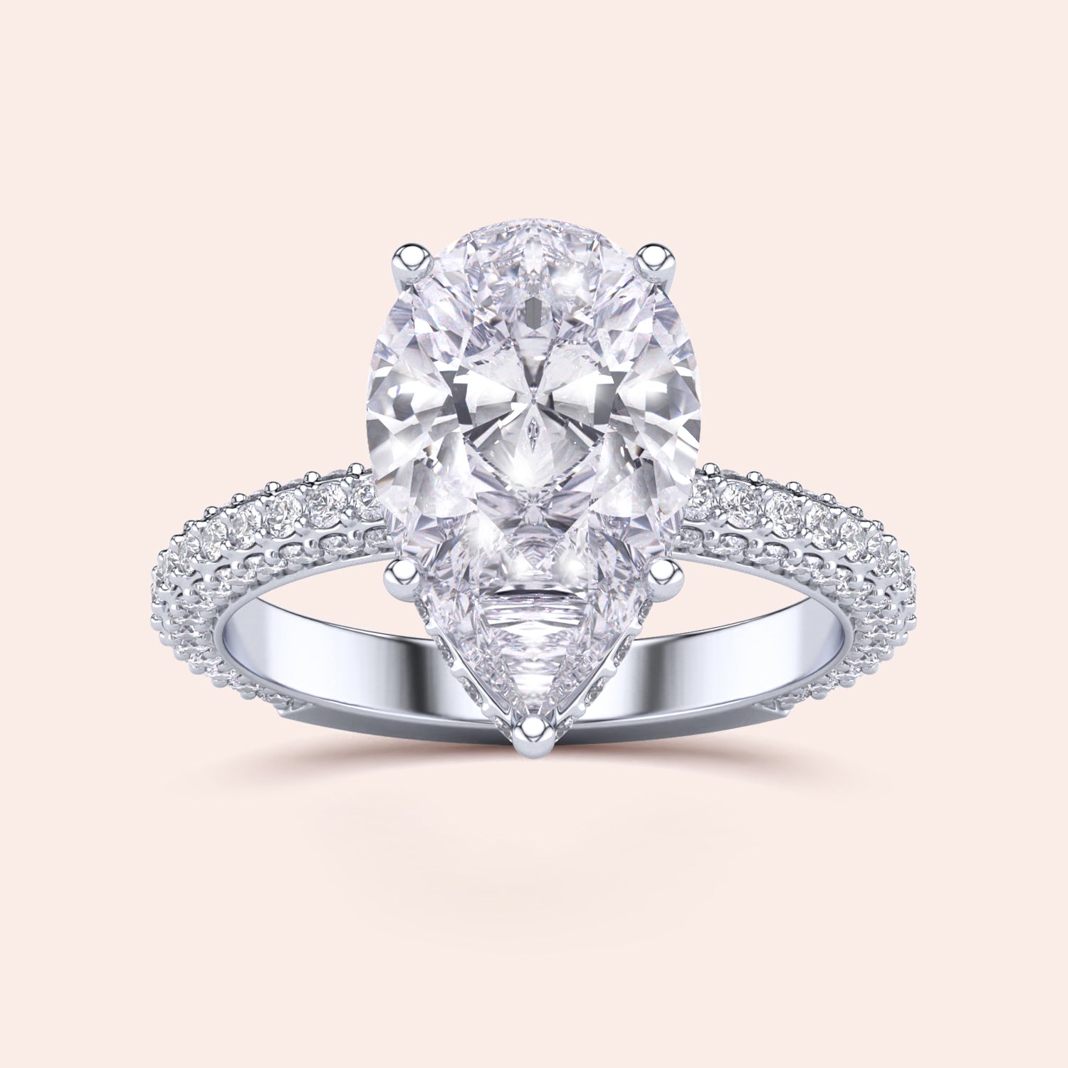 Elegant 14K/18K white gold engagement ring featuring a pear-shaped diamond with a hidden halo and pave accents.|
#14KRecycledWhiteGold
#18KRecycledWhiteGold
#Platinum