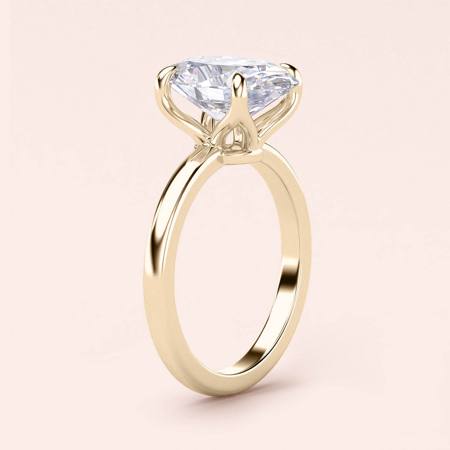 Elegant 14K yellow gold engagement ring with a marquise-shaped diamond in a tulip mount and plain band.|
#14KRecycledYellowGold
#18KRecycledYellowGold