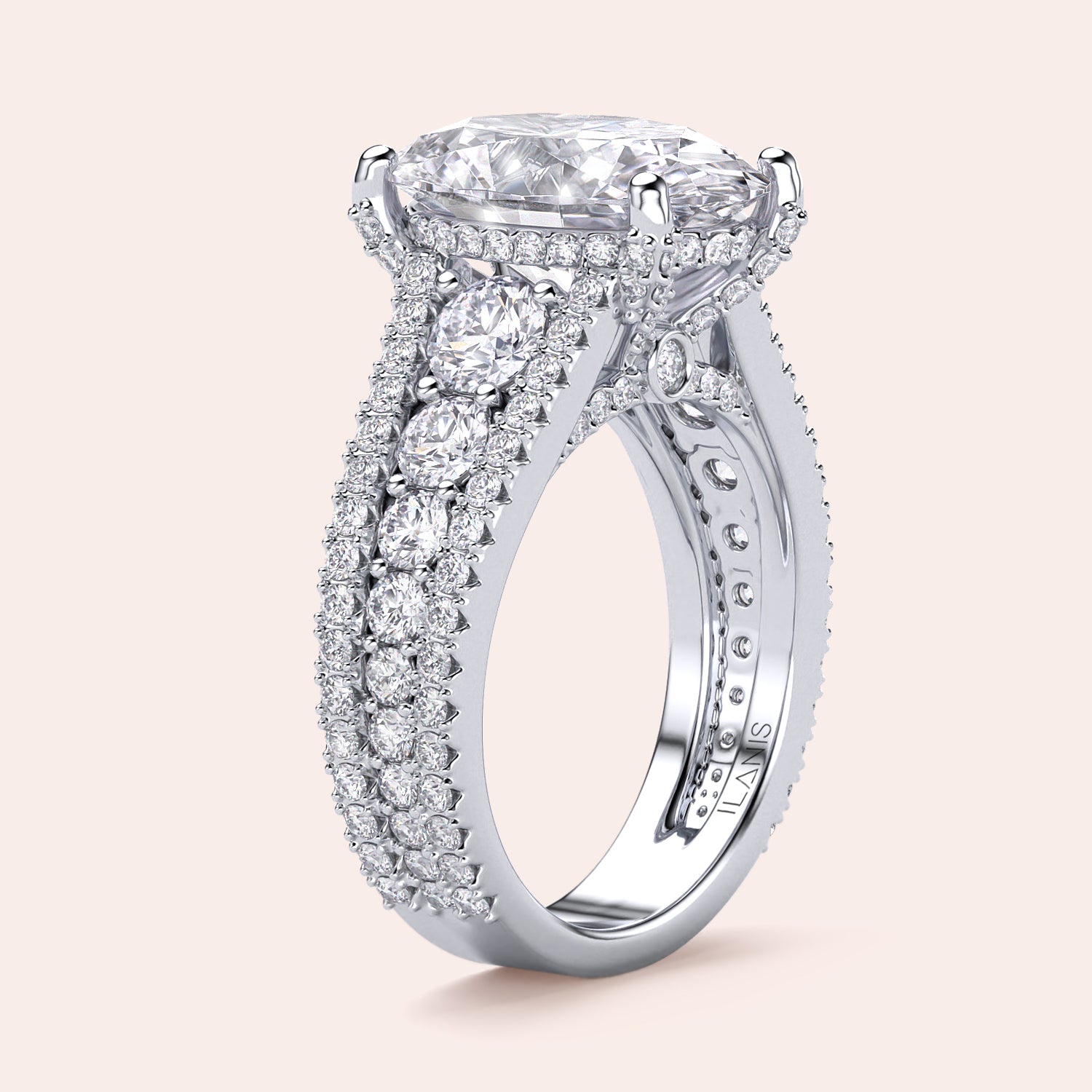 Luxurious 14K/18K white gold oval-shaped diamond engagement ring with intricate detailing and smaller diamonds along the three-row band.|
#14KRecycledWhiteGold
#18KRecycledWhiteGold
#Platinum