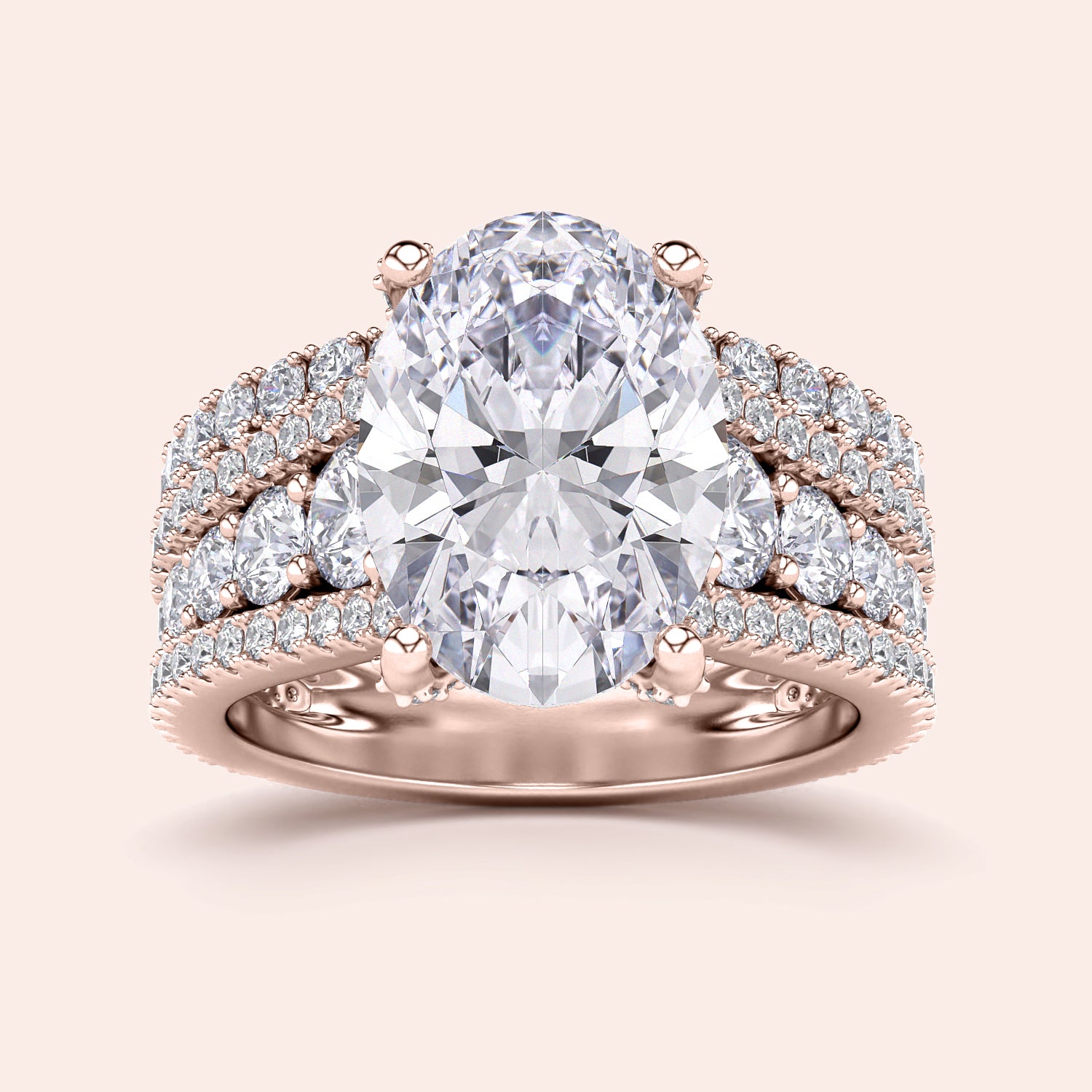"Luxurious rose gold engagement ring with oval hidden halo accents and three-row band, available in 14K or 18K gold."|
#14KRecycledRoseGold
#18KRecycledRoseGold