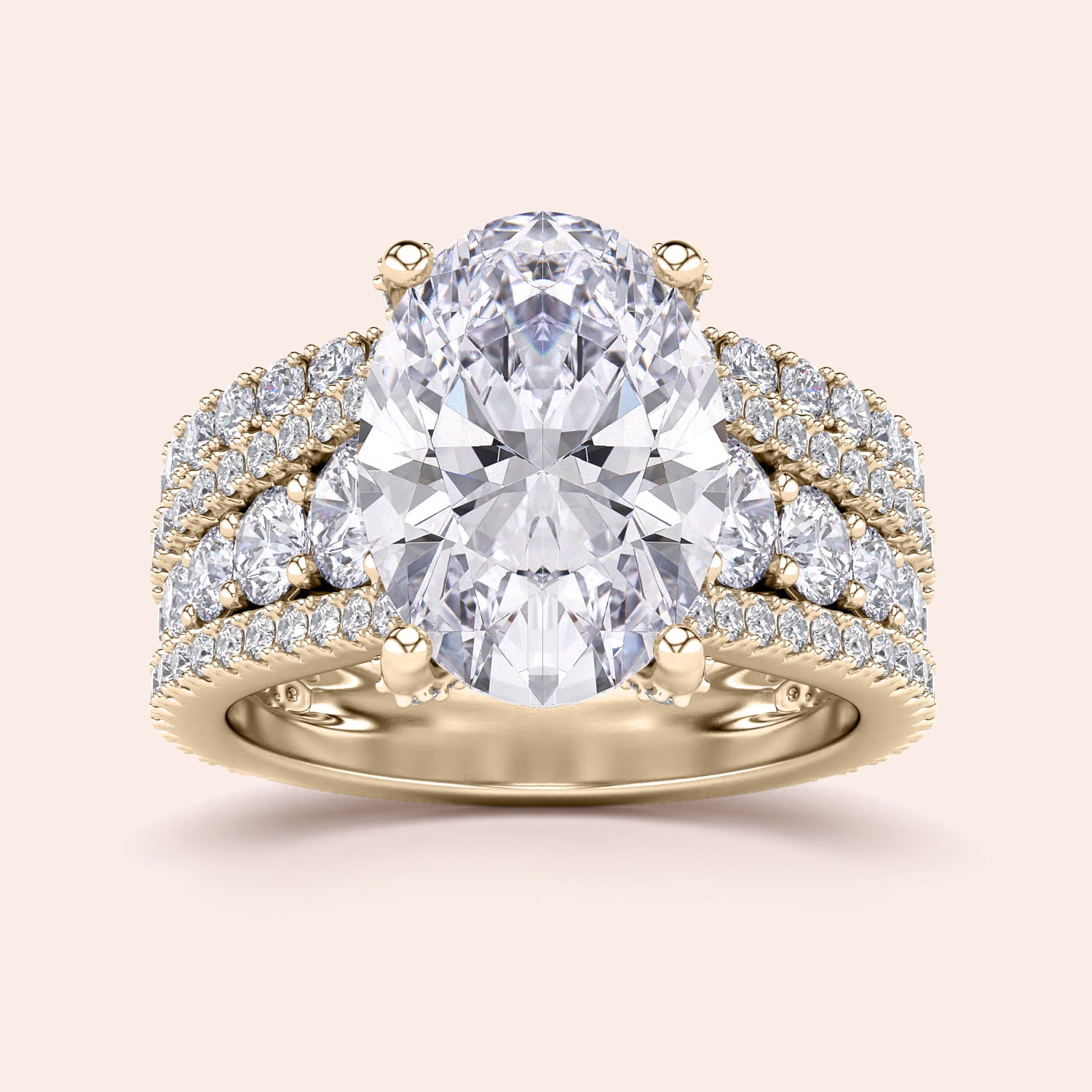 Luxury engagement ring in 14K or 18K gold featuring an oval-cut diamond withPave accents and a three-row band design.|
#14KRecycledYellowGold
#18KRecycledYellowGold