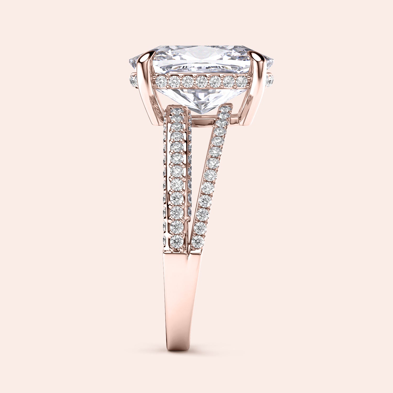 Elegant rose gold engagement ring featuring a radiant cushion diamond and split shank band adorned with round diamonds.|
#14KRecycledRoseGold
#18KRecycledRoseGold