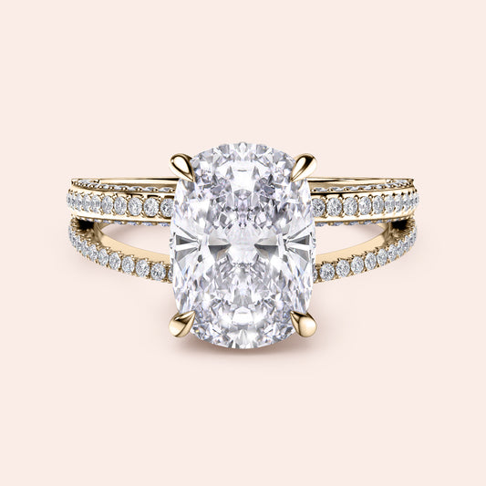 Elegant 14K yellow gold engagement ring with cushion diamond centerpiece and split shank design, featuring dazzling smaller diamonds.