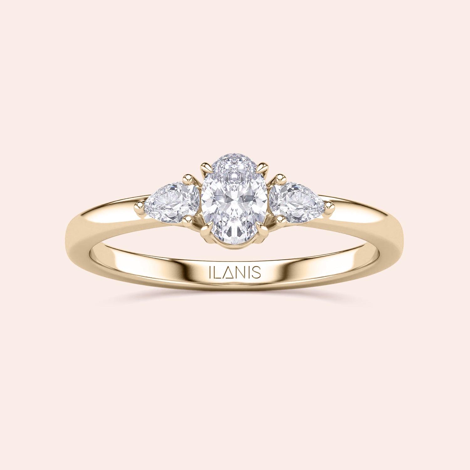 14K gold engagement ring featuring an oval center diamond and two pear-shaped side diamonds, perfect for an elegant touch.|
#14KRecycledYellowGold
#18KRecycledYellowGold