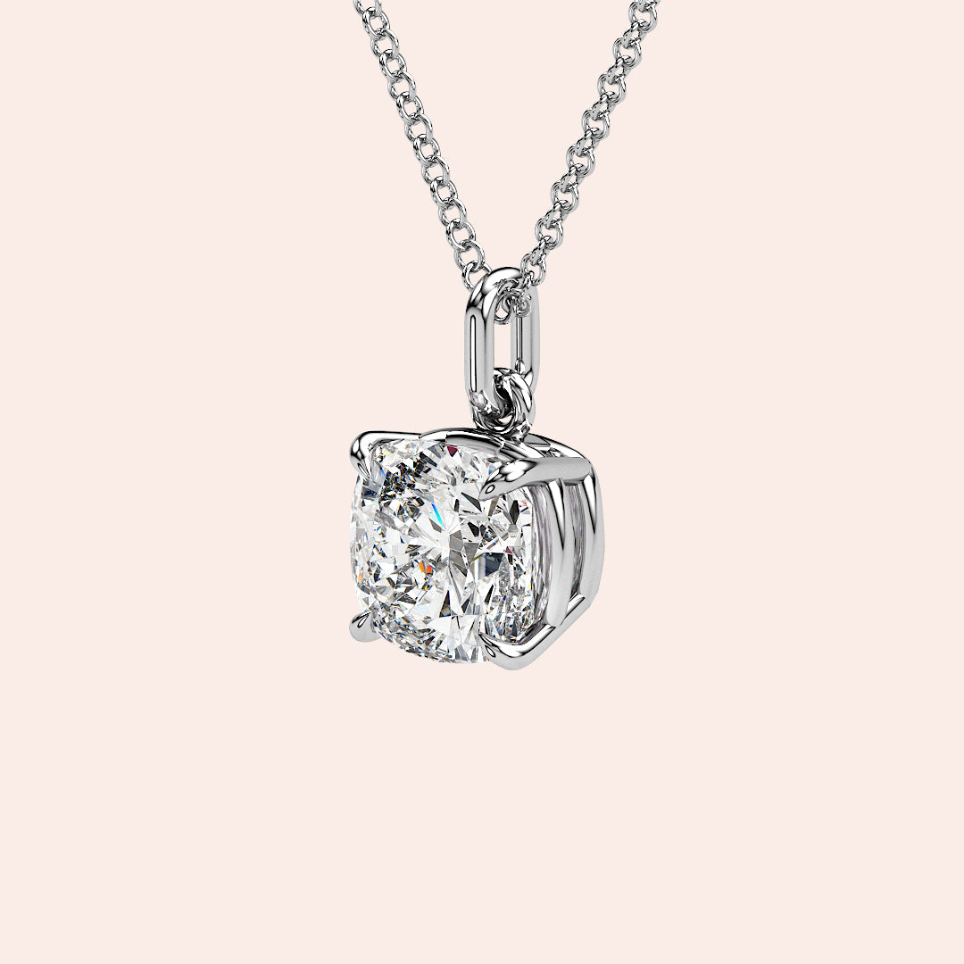 A front-facing view of a cushion-cut solitaire diamond pendant set in a delicate four-prong white gold setting. This classic and elegant design enhances the diamond’s brilliance, making it an iconic jewelry staple for any occasion.| #14KRecycledWhiteGold #18KRecycledWhiteGold