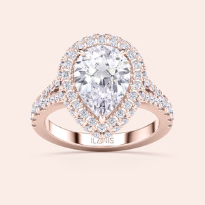 Pear shaped halo diamond ring in rose gold with pavé band, elevated setting with detailed side profile and elegant structure 