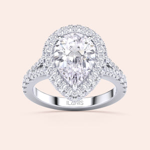 Pear cut diamond halo ring white gold, double halo pavé setting with center pear diamond and symmetrical brilliance 