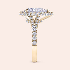 Pear cut diamond halo ring yellow gold, double halo pavé setting with center pear diamond and balanced proportions 