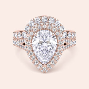 Rose gold pear diamond halo engagement ring set side view, pavé band with matching wedding ring, luxury bridal set 
