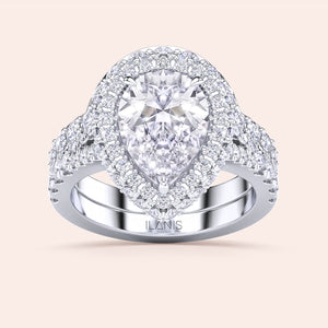 Pear shaped diamond halo bridal ring set in white gold, engagement ring and wedding band duo, perfect for proposal 