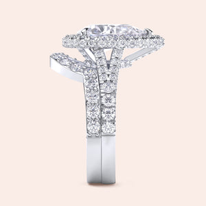 White gold pear diamond halo engagement ring set side view, pavé band with matching wedding ring, luxury bridal set 